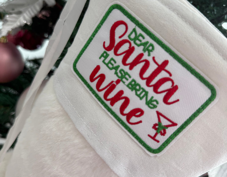 White fur Stocking “ Santa please bring wine “