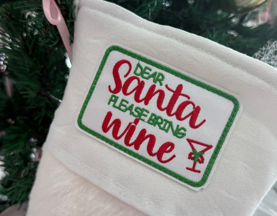 White fur Stocking “ Santa please bring wine “